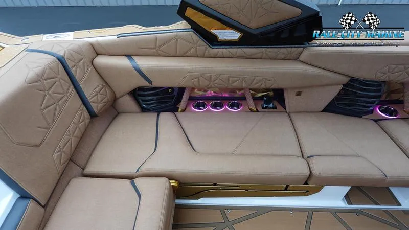Slide: The Image of Luxurious interior of 2025 Nautique Super Air Nautique G23 Paragon with ambient lighting. - 32