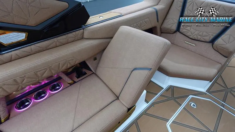 Slide: The Image of Luxurious interior of 2025 Nautique Super Air Nautique G23 Paragon with ambient lighting. - 36