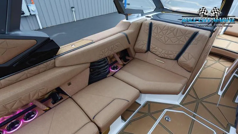 Slide: The Image of 2025 Nautique Super Air Nautique G23 Paragon interior with luxurious tan seating and modern design. - 37