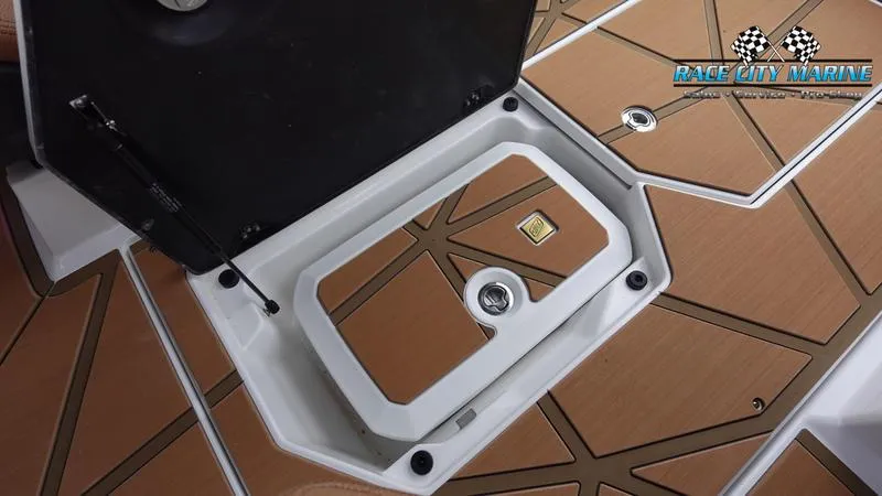 Slide: The Image of 2025 Nautique Super Air Nautique G23 Paragon storage compartment with teak flooring. - 41