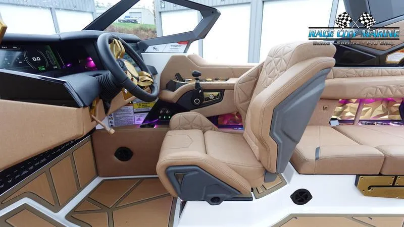 Slide: The Image of Interior of 2025 Nautique Super Air Nautique G23 Paragon with luxurious seating and modern dashboard. - 42