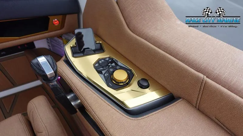 Slide: The Image of 2025 Nautique Super Air Nautique G23 Paragon control panel with luxurious gold accents. - 45
