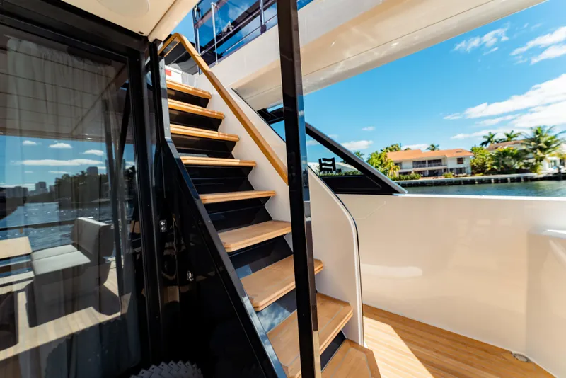Slide: The Image of Staircase on 2023 Ferretti Yachts 860, with scenic waterfront view. - 15