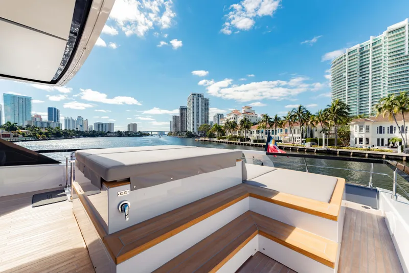 Slide: The Image of 2023 Ferretti Yachts 860 on scenic waterfront with city skyline. - 18