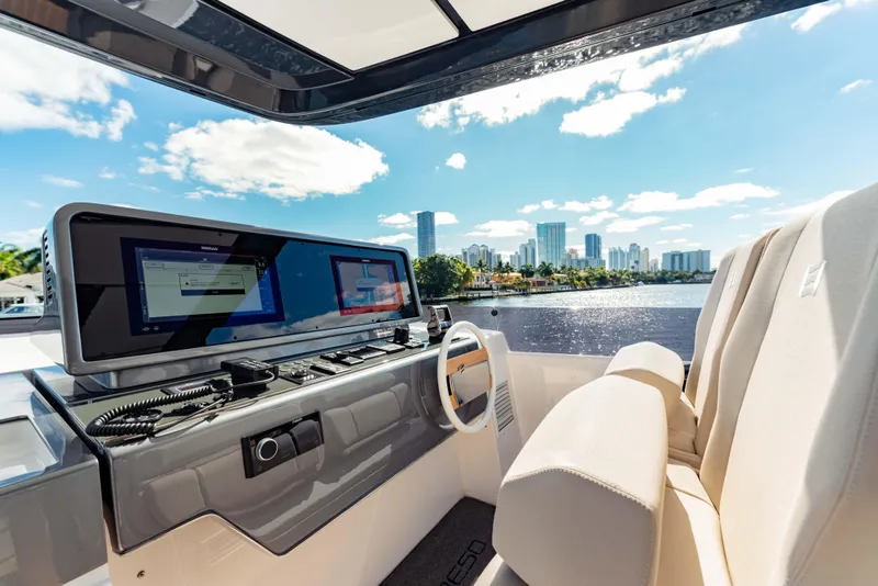 Slide: The Image of Luxurious 2023 Ferretti Yachts 860 helm with city skyline view. - 24