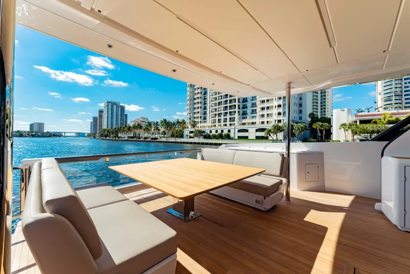 Slide: The Image of Luxurious 2023 Ferretti Yachts 860 deck with waterfront city view. - 34