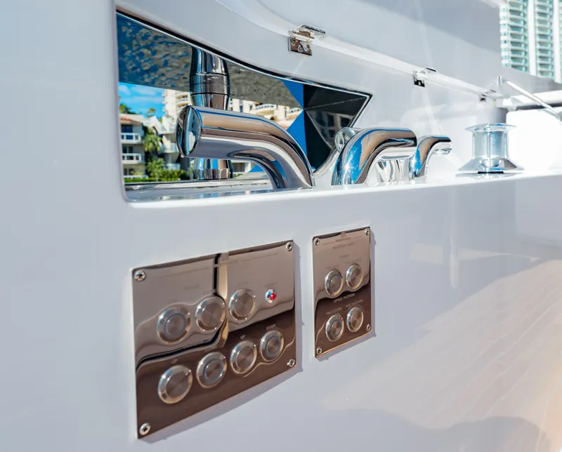 Slide: The Image of Ferretti Yachts 860, 2023 model, featuring sleek chrome fixtures and modern control panels. - 37