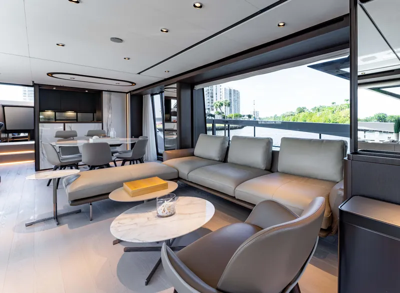 Slide: The Image of Luxurious interior of 2023 Ferretti Yachts 860 with modern seating and scenic views. - 40