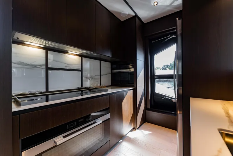 Slide: The Image of Luxurious kitchen interior of 2023 Ferretti Yachts 860 with modern appliances and sleek design. - 46