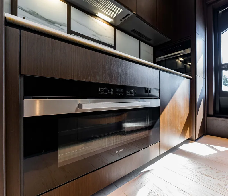 Slide: The Image of Modern kitchen interior on 2023 Ferretti Yachts 860, featuring sleek cabinetry and appliances. - 49