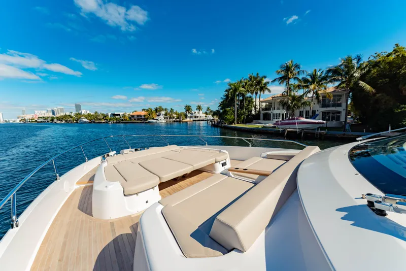 Slide: The Image of Luxurious 2023 Ferretti Yachts 860 on a sunny waterfront with palm trees. - 9