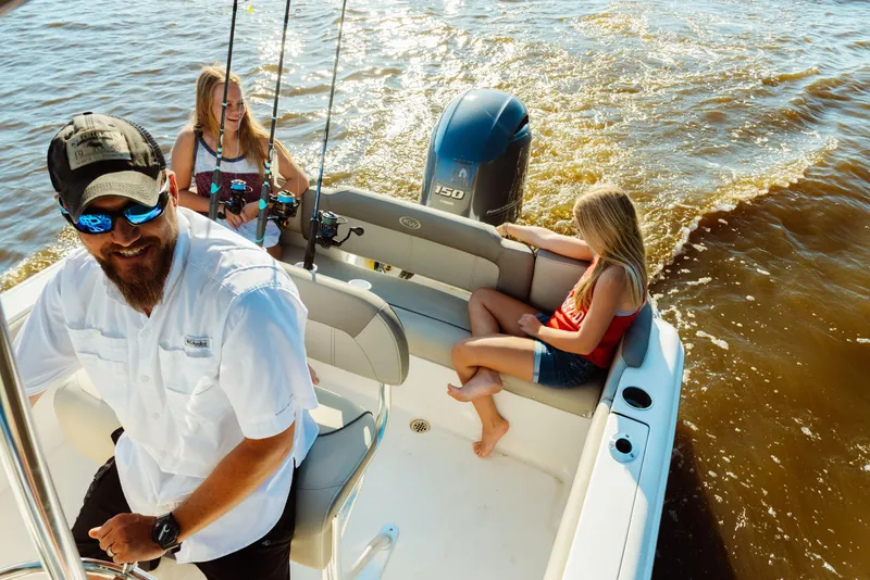 Slide: The Image of Family enjoying a ride on a 2025 Key West 203 FS boat. - 5