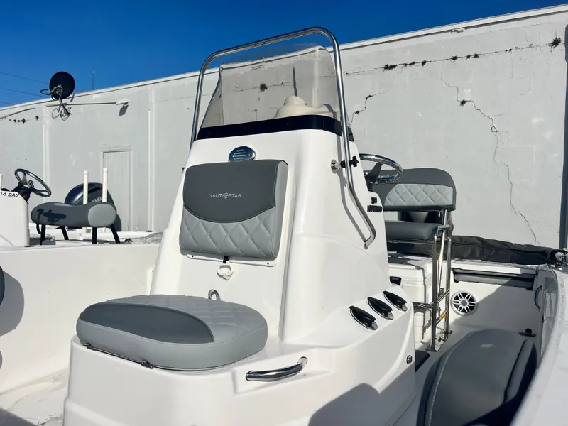 Slide: The Image of 2025 NauticStar 191 Hybrid boat with sleek design and comfortable seating. - 5