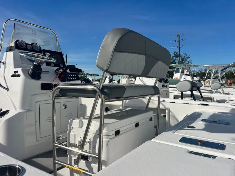 Slide: The Image of 2025 NauticStar 191 Hybrid boat interior with seating and console. - 8