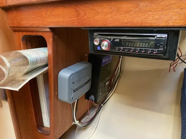 Slide: The Image of 1989 Catalina 30 interior with JVC stereo and navigation equipment. - 14