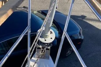 Slide: The Image of Sailboat mast of 1989 Catalina 30, parked car visible below. - 15