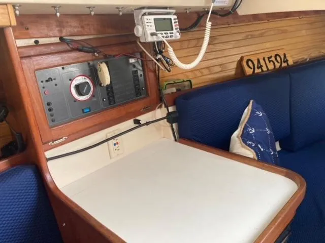 Slide: The Image of Interior of a 1989 Catalina 30 sailboat with navigation equipment and seating area. - 18