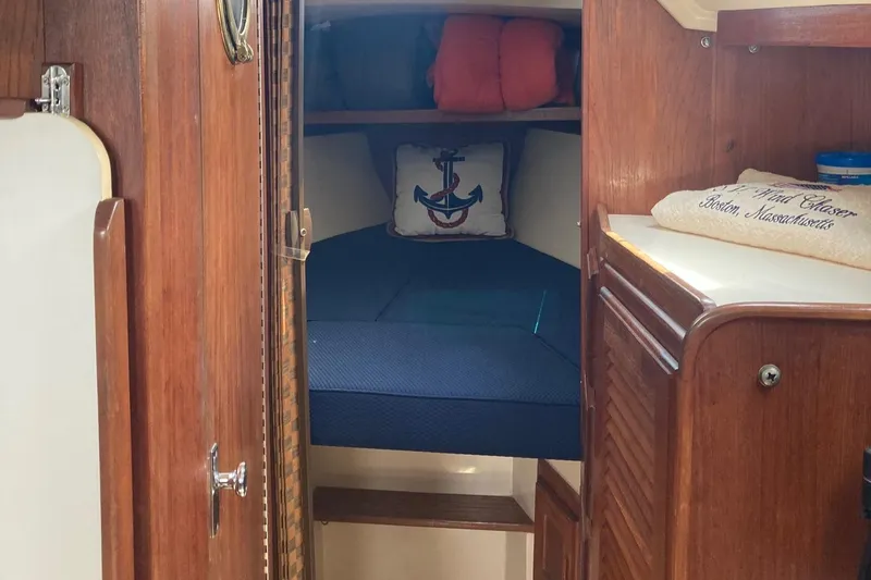 Slide: The Image of Cozy cabin interior of 1989 Catalina 30 sailboat with nautical decor. - 29