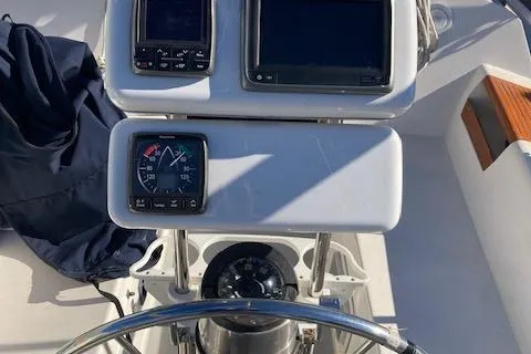 Slide: The Image of Cockpit of 1989 Catalina 30 sailboat with navigation instruments and steering wheel. - 3