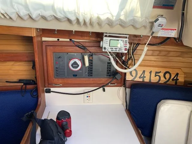 Slide: The Image of Interior of a 1989 Catalina 30 sailboat with navigation equipment and seating area. - 7