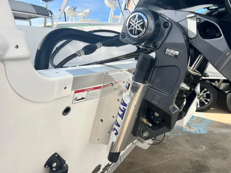 Slide: The Image of Close-up of 2025 NauticStar 211 Hybrid boat engine and hydraulic system. - 10