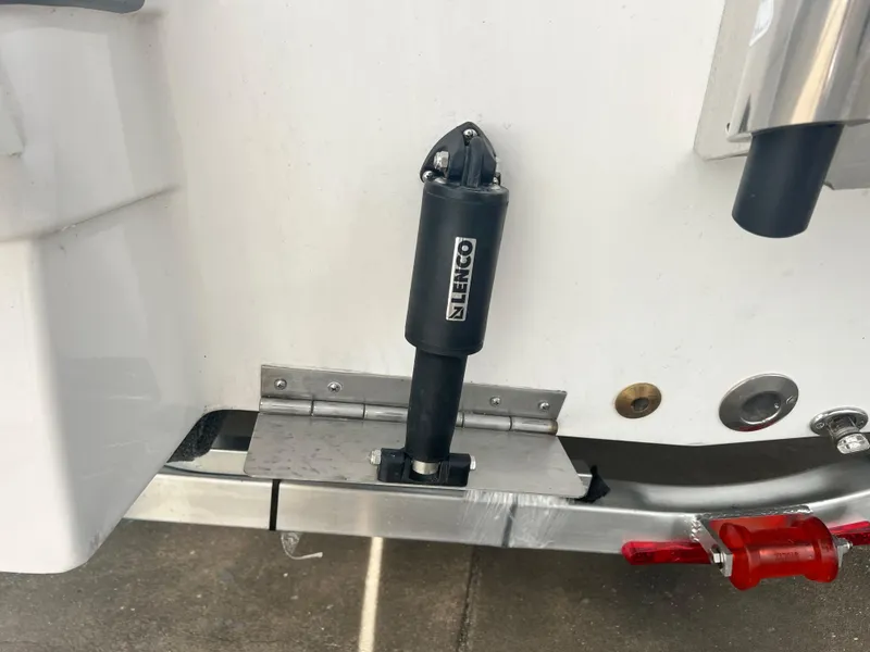 Slide: The Image of 2025 NauticStar 211 Hybrid boat with Lenco trim tab actuator. - 11