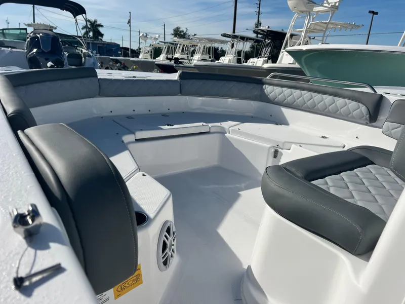 Slide: The Image of 2025 NauticStar 211 Hybrid boat interior with cushioned seating and modern design. - 4