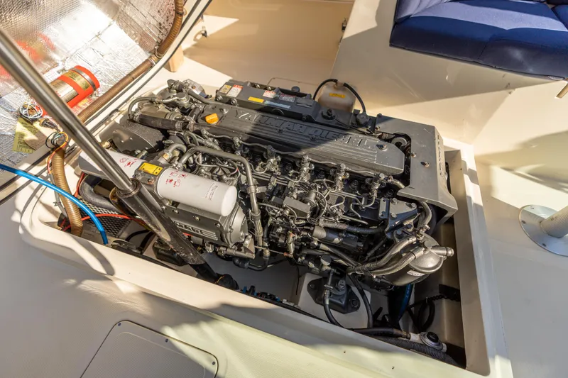 Slide: The Image of Engine compartment of a 2003 Hinckley Talaria 29 Runabout, showcasing detailed mechanical components. - 43