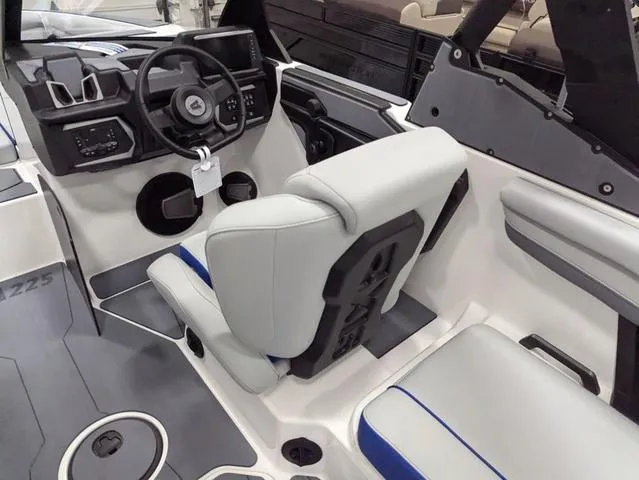 Slide: The Image of 2025 Axis A225 boat interior with modern steering and seating. - 10