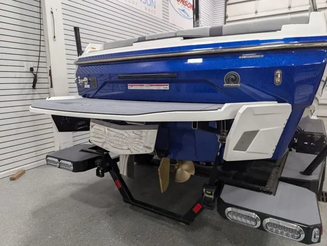 Slide: The Image of 2025 Axis A225 boat rear view with swim platform and propeller. - 5