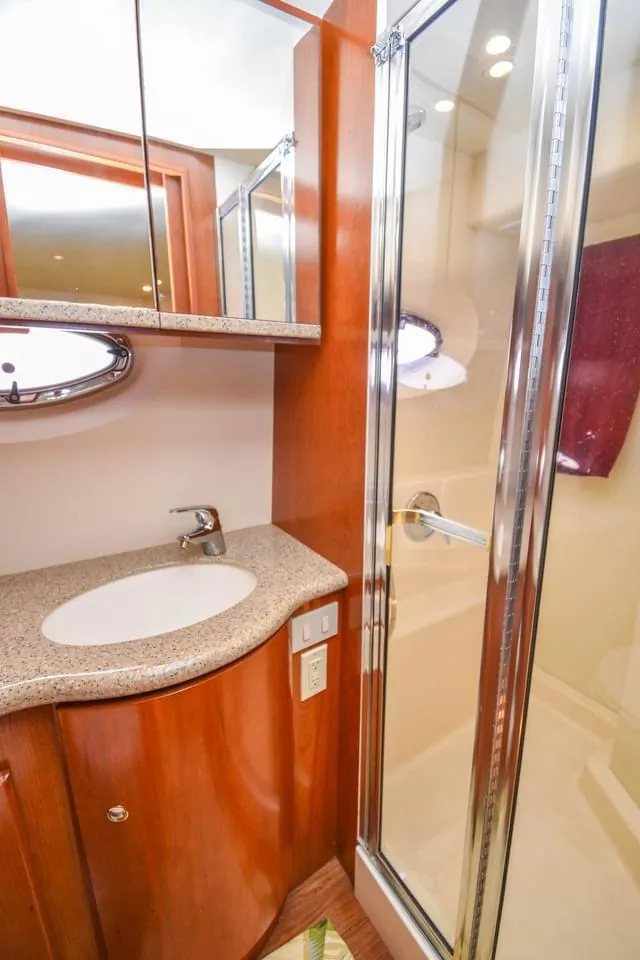 Slide: The Image of 2007 Silverton 35 Motor Yacht bathroom with sink and shower. - 12
