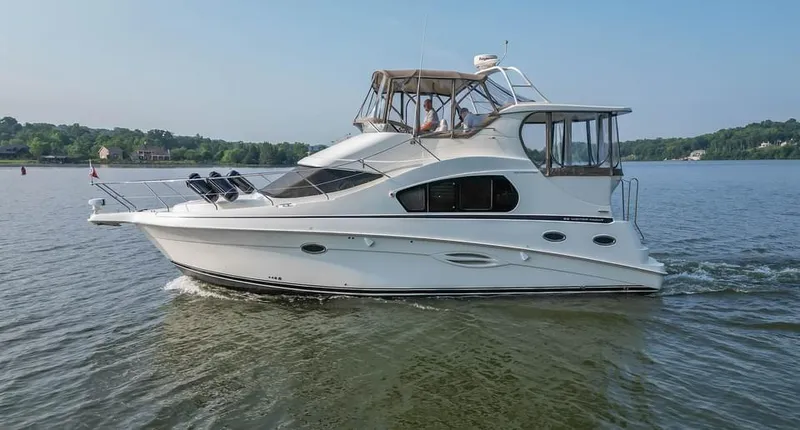 Slide: The Image of 2007 Silverton 35 Motor Yacht cruising on a calm lake. - 27