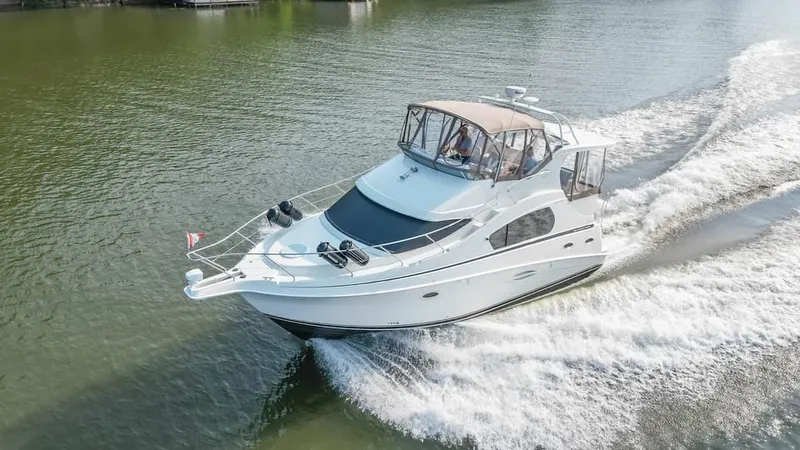 Slide: The Image of 2007 Silverton 35 Motor Yacht cruising on a calm lake. - 4