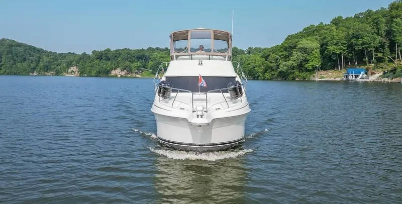 Slide: The Image of 2007 Silverton 35 Motor Yacht cruising on a serene lake. - 6