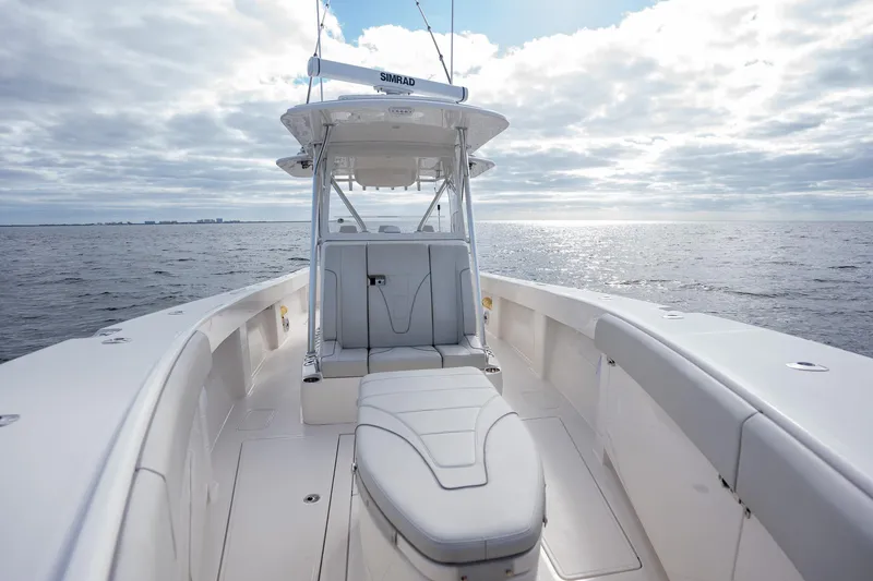 Slide: The Image of 2022 SeaVee 370z boat on open water under cloudy sky. - 16
