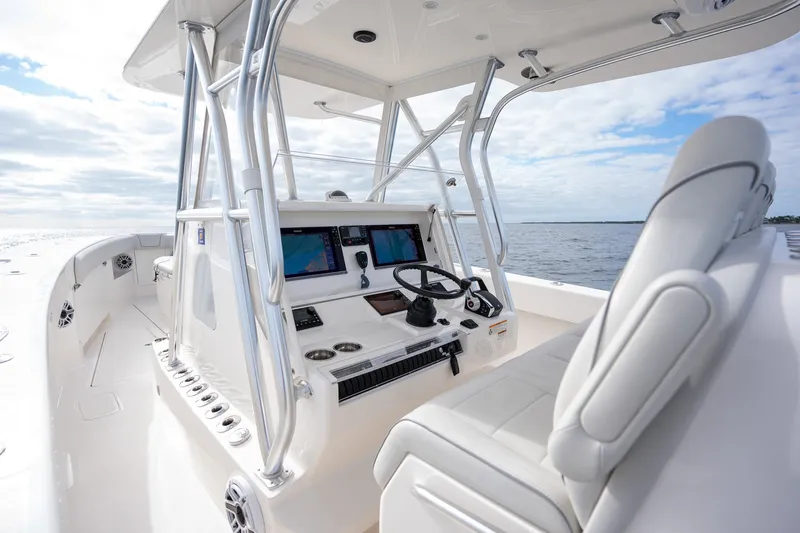 Slide: The Image of 2022 SeaVee 370z boat helm with modern controls and ocean view. - 18
