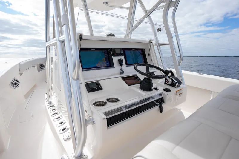 Slide: The Image of 2022 SeaVee 370z boat helm with dual screens and steering wheel. - 19