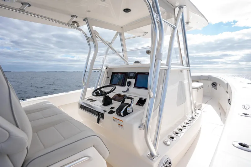 Slide: The Image of 2022 SeaVee 370z boat interior with modern helm and ocean view. - 20