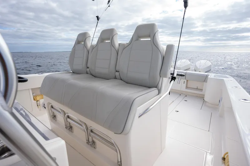Slide: The Image of 2022 SeaVee 370z boat with comfortable seating, ocean backdrop. - 22