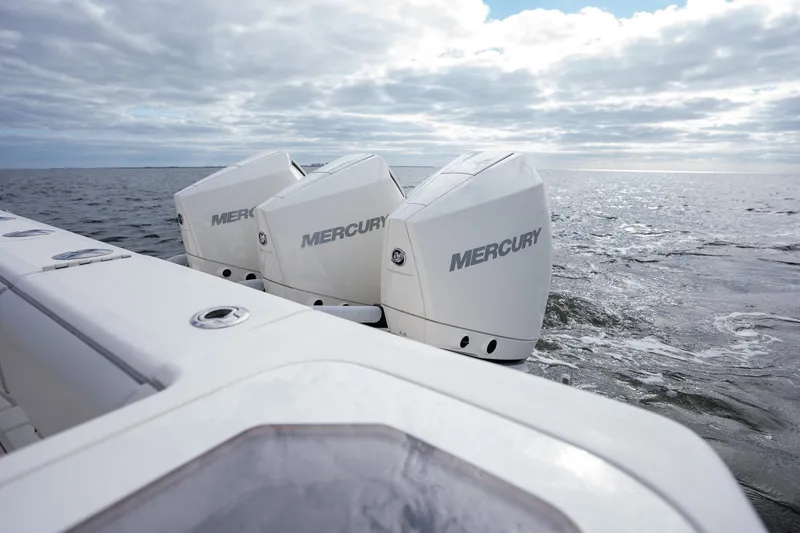 Slide: The Image of SeaVee 370z 2022 boat with triple Mercury outboard engines on open water. - 28