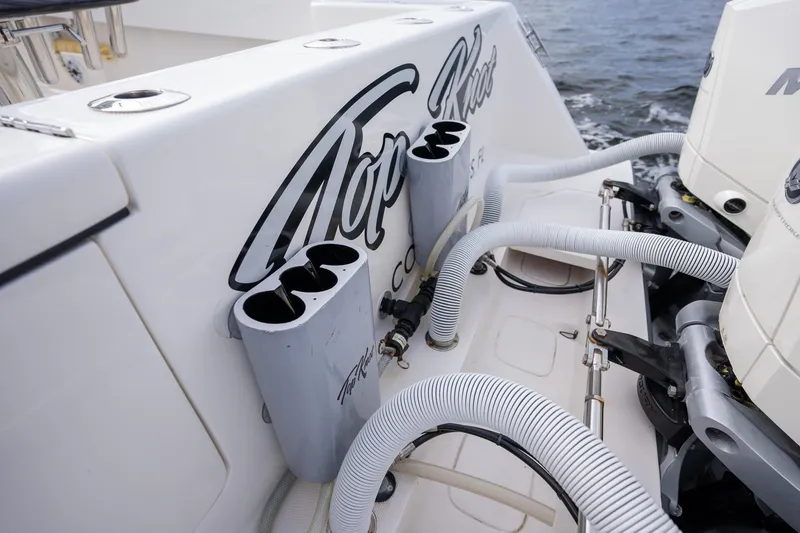 Slide: The Image of SeaVee 370z 2022 boat with custom rod holders and engine hoses. - 29