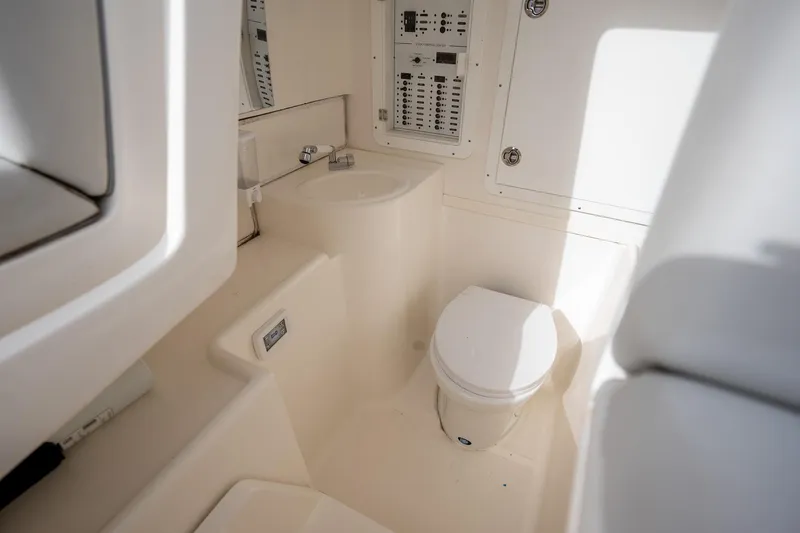 Slide: The Image of 2022 SeaVee 370z boat interior bathroom with toilet and sink. - 30