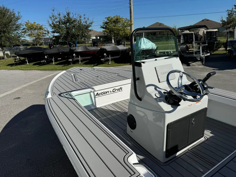 Slide: The Image of 2025 Action Craft 17 FLYFISHER boat with sleek design and modern console. - 10