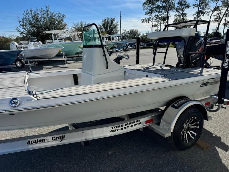 Slide: The Image of 2025 Action Craft 17 FLYFISHER boat on trailer in sunny outdoor setting. - 3