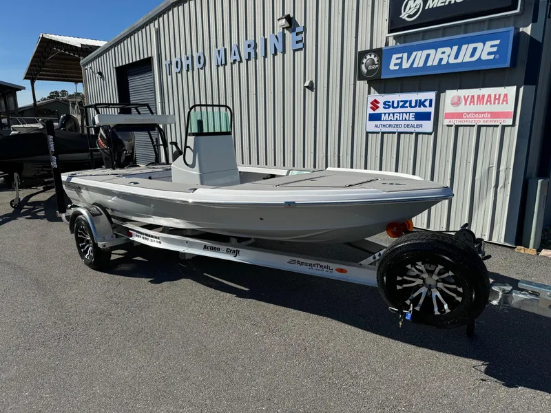Slide: The Image of 2025 Action Craft 17 Flyfisher boat on trailer outside marine dealership. - 4