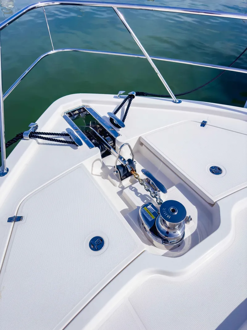 Slide: The Image of 2024 Riviera SMY 46 yacht deck with anchor system and chrome fittings. - 7