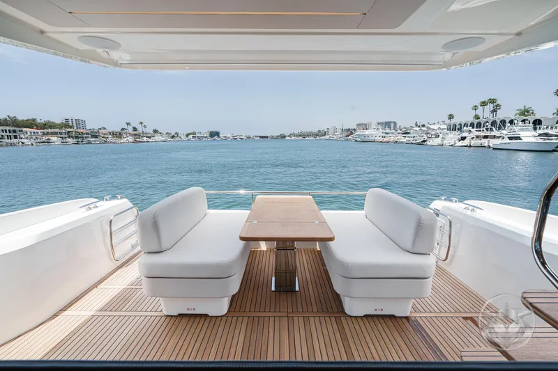 Slide: The Image of Luxurious Prestige F4.9 yacht deck with seating, overlooking marina, 2025 model. - 23