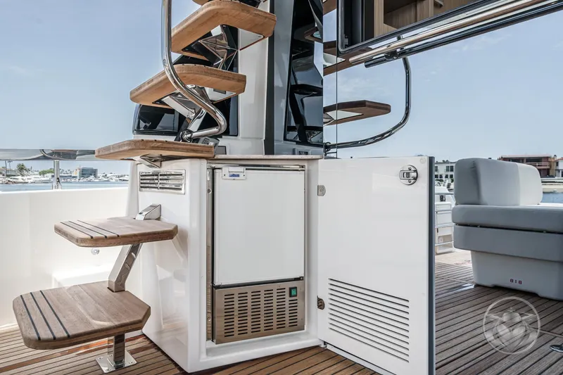 Slide: The Image of Luxury yacht Prestige F4.9, 2025 model, featuring elegant wooden steps and sleek design. - 24