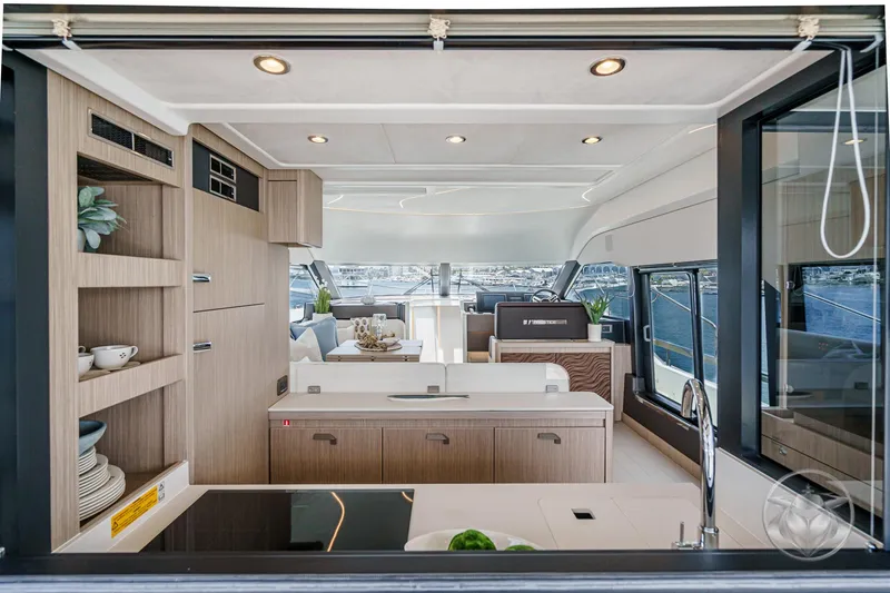 Slide: The Image of Luxurious interior of 2025 Prestige F4.9 yacht with modern kitchen and elegant decor. - 25