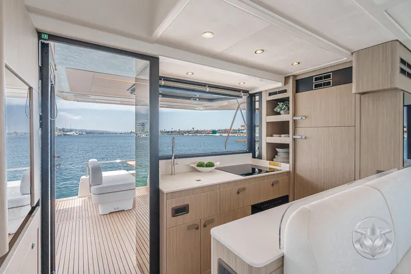 Slide: The Image of Luxurious 2025 Prestige F4.9 yacht interior with modern kitchen and ocean view. - 26